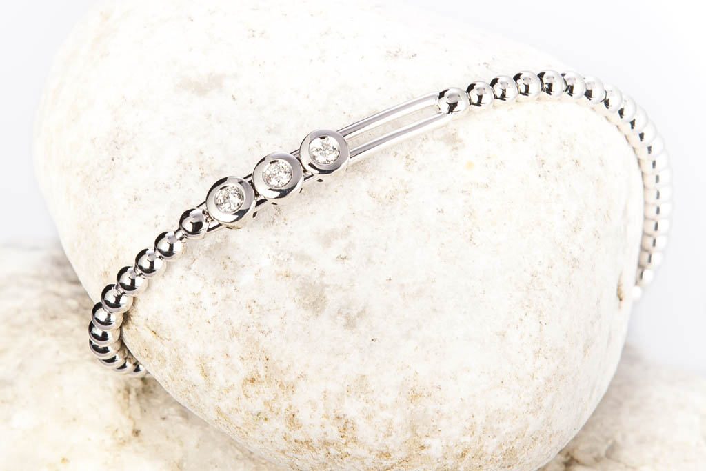 bracelet flexible boules or blanc rail diamants